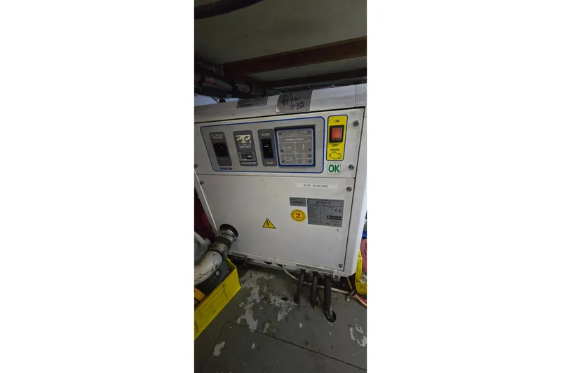 Slide: The Image of Control panel inside a 1977 Bertram 42 Flybridge Motor Yacht engine room. - 58