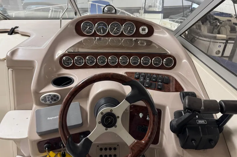 Slide: The Image of 2001 Regal Commodore 2760 boat dashboard with steering wheel and instrument panel. - 10