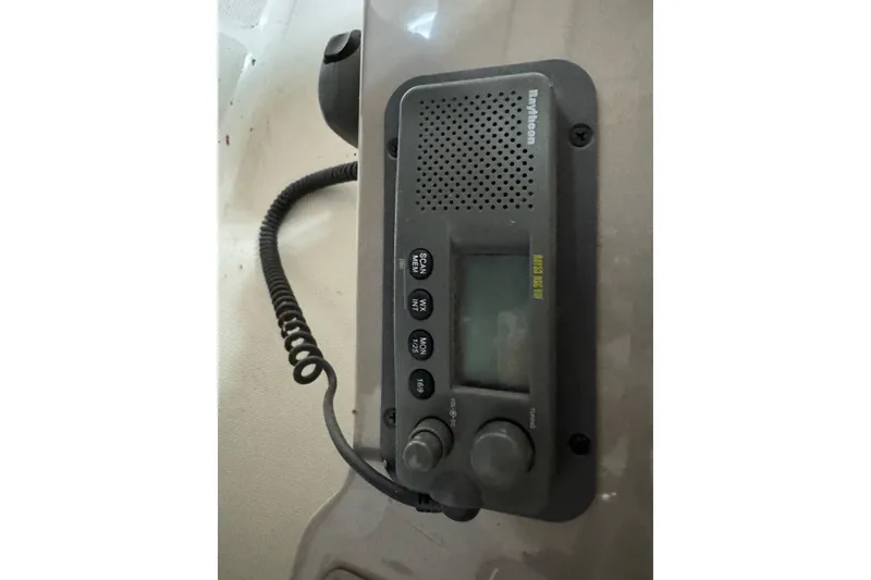 Slide: The Image of 2001 Regal Commodore 2760 boat radio system with coiled microphone cable. - 12