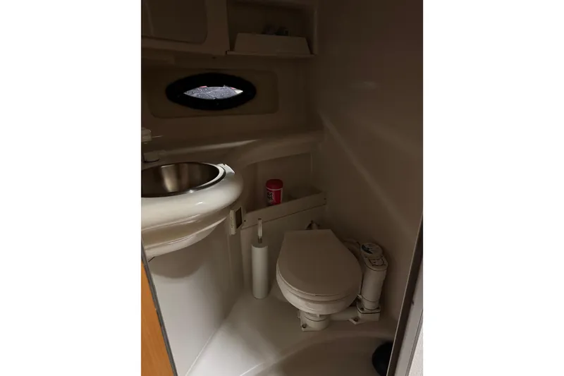 Slide: The Image of Compact bathroom in 2001 Regal Commodore 2760 boat with sink and toilet. - 15