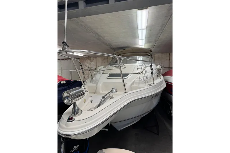 Slide: The Image of 2001 Regal Commodore 2760 boat in storage, featuring sleek design and spacious deck. - 4