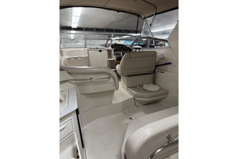 Slide: The Image of 2001 Regal Commodore 2760 boat interior with helm and seating area. - 9