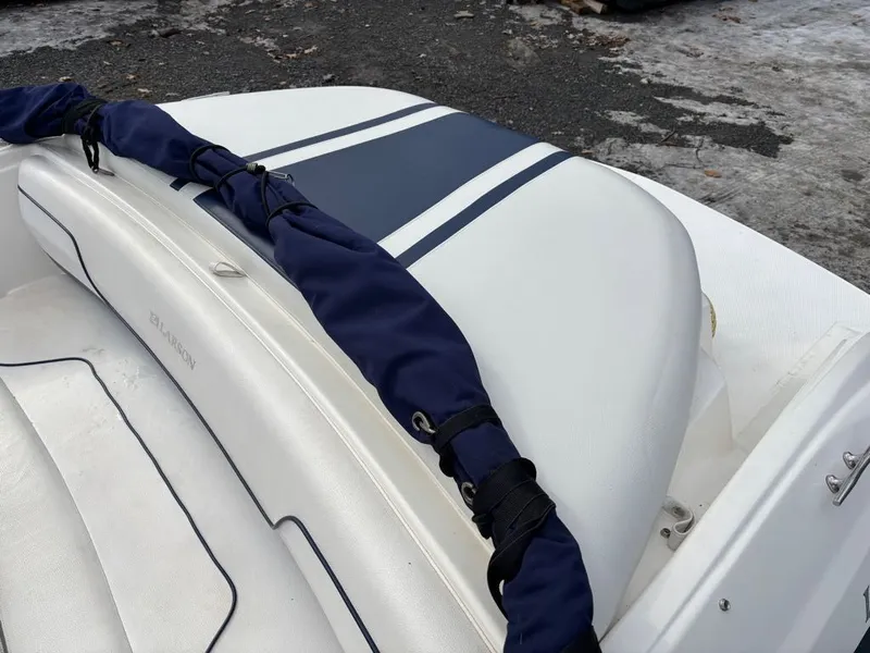 Slide: The Image of Larson 850 boat, white interior with blue accents, year 2011. - 22
