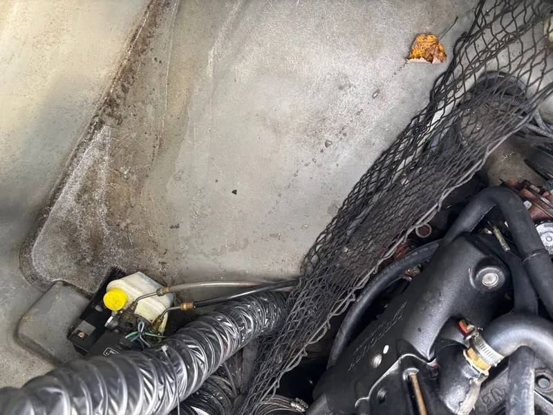 Slide: The Image of Interior of a 2011 Larson 850 boat engine compartment. - 26