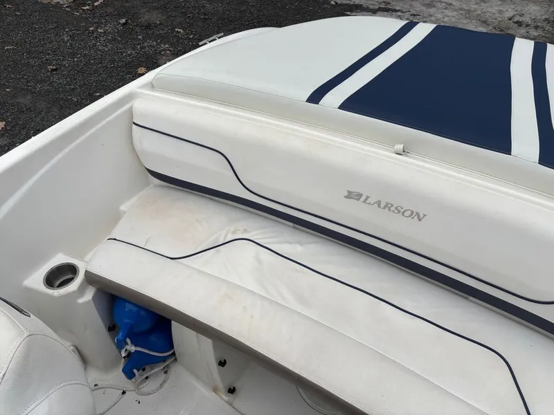 Slide: The Image of Interior of a 2011 Larson 850 boat with blue stripes. - 4