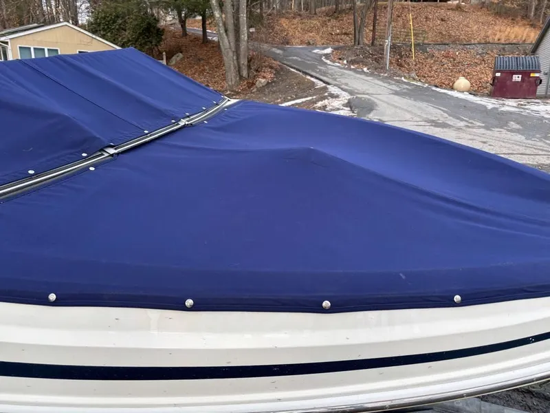 Slide: The Image of Larson 850 boat with blue cover, year 2011. - 6
