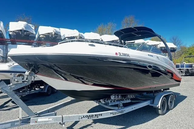 The Image of 2018 Godfrey Hurricane SD2486 boat on trailer under clear blue sky. - 0
