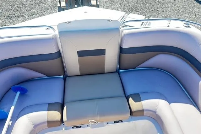 Slide: The Image of 2018 Godfrey Hurricane SD2486 boat interior with cushioned seating and paddle. - 10