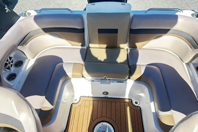 Slide: The Image of 2018 Godfrey Hurricane SD2486 boat interior with cushioned seating and wood-style flooring. - 14