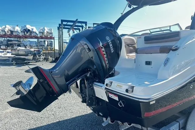 Slide: The Image of 2018 Godfrey Hurricane SD2486 boat with Yamaha outboard motor in a marina setting. - 4