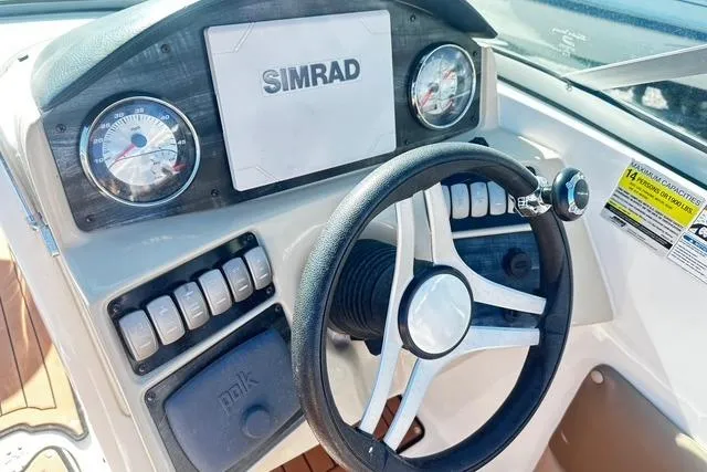 Slide: The Image of 2018 Godfrey Hurricane SD2486 boat dashboard with steering wheel and Simrad display. - 6