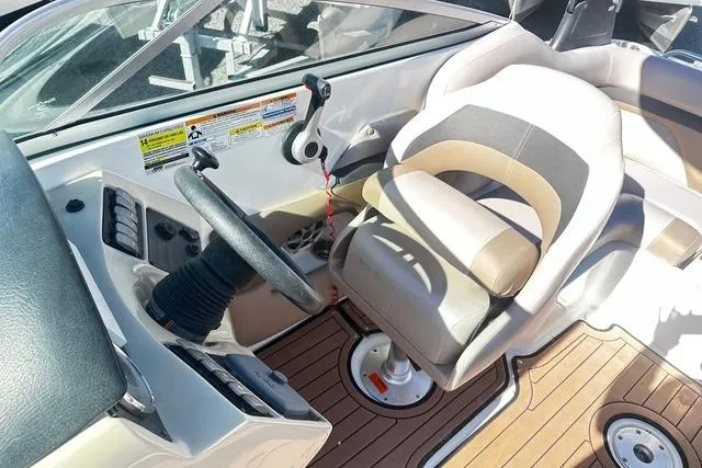 Slide: The Image of 2018 Godfrey Hurricane SD2486 boat cockpit with steering wheel and captain's chair. - 7
