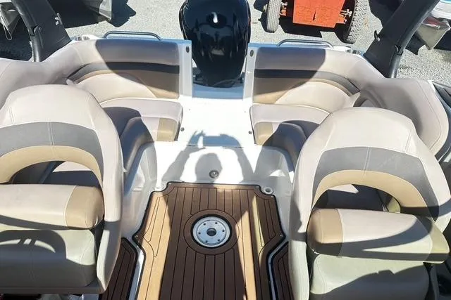Slide: The Image of 2018 Godfrey Hurricane SD2486 boat interior with seating and wood-style flooring. - 8