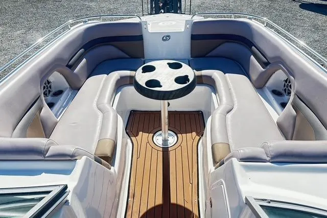 Slide: The Image of 2018 Godfrey Hurricane SD2486 boat interior with cushioned seating and central table. - 9