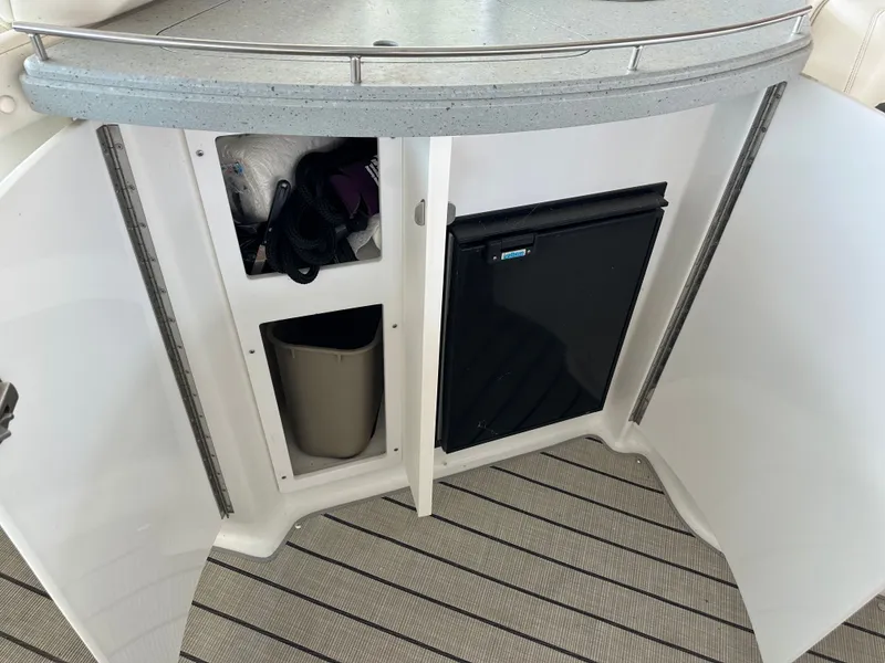 Slide: The Image of Interior of a 2008 Cobalt 323 with storage and fridge. - 13