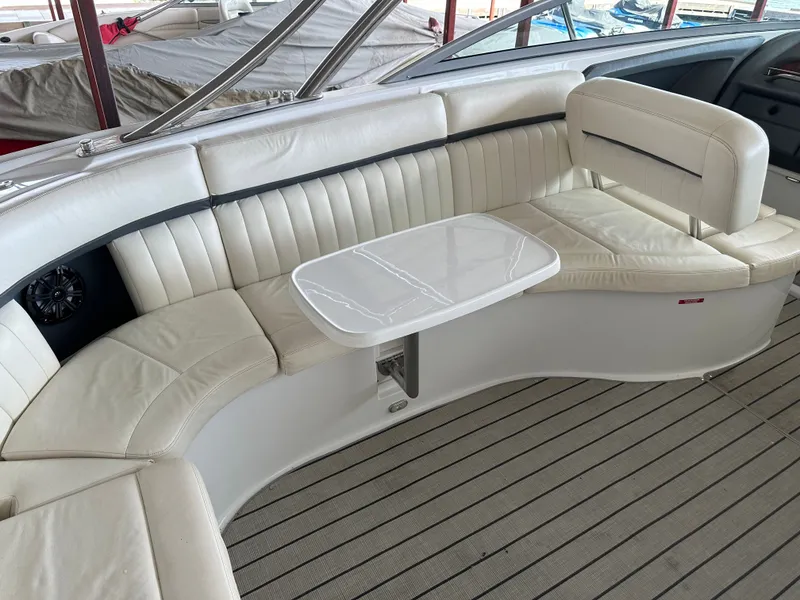 Slide: The Image of Interior of a 2008 Cobalt 323 boat with white leather seating. - 17