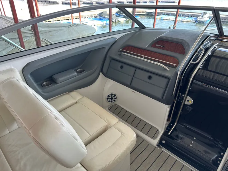 Slide: The Image of Interior of a 2008 Cobalt 323 boat with beige seating. - 25