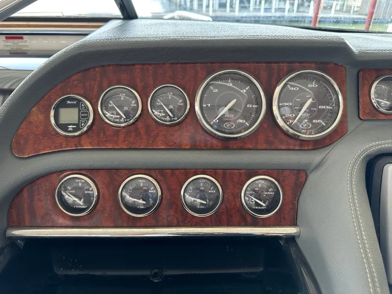 Slide: The Image of Dashboard of a 2008 Cobalt 323 with wood paneling. - 27