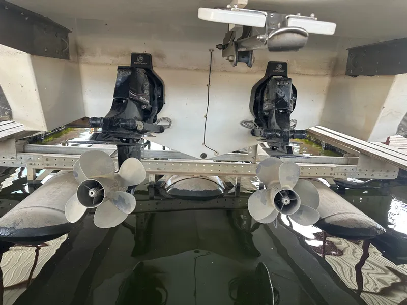 Slide: The Image of Rear view of a 2008 Cobalt 323 boat with dual engines. - 3