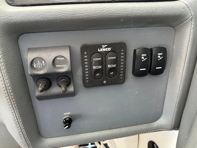 Slide: The Image of Control panel of a 2008 Cobalt 323 boat with Lenco controls. - 31