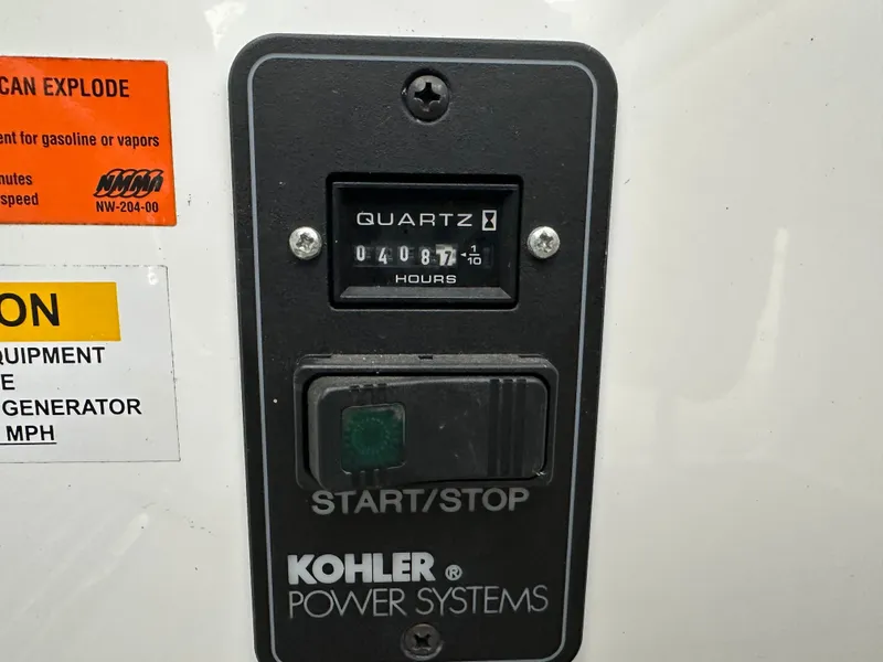 Slide: The Image of Kohler Power Systems control panel with hour meter, 4087 hours. - 33