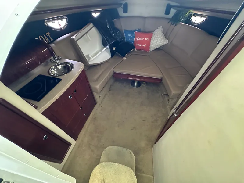 Slide: The Image of Interior of a 2008 Cobalt 323 yacht with kitchenette and seating area. - 35