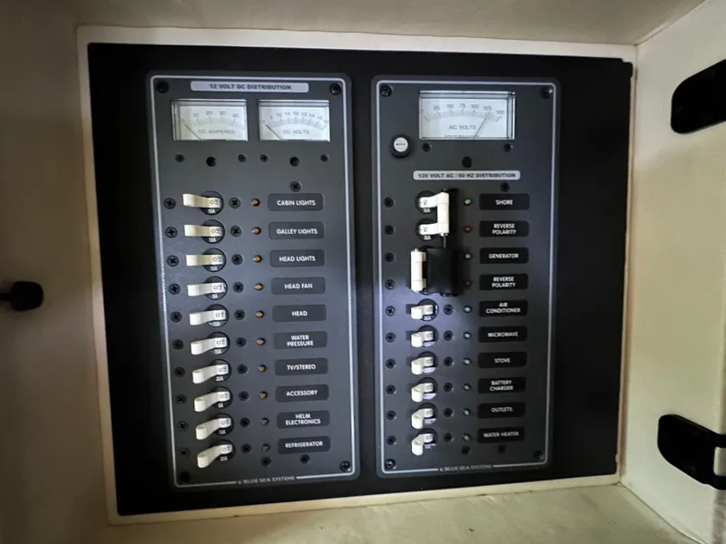 Slide: The Image of Electrical control panel of a 2008 Cobalt 323 boat. - 36