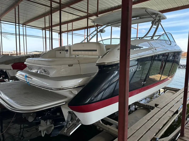 Slide: The Image of 2008 Cobalt 323 boat in covered dock. - 4