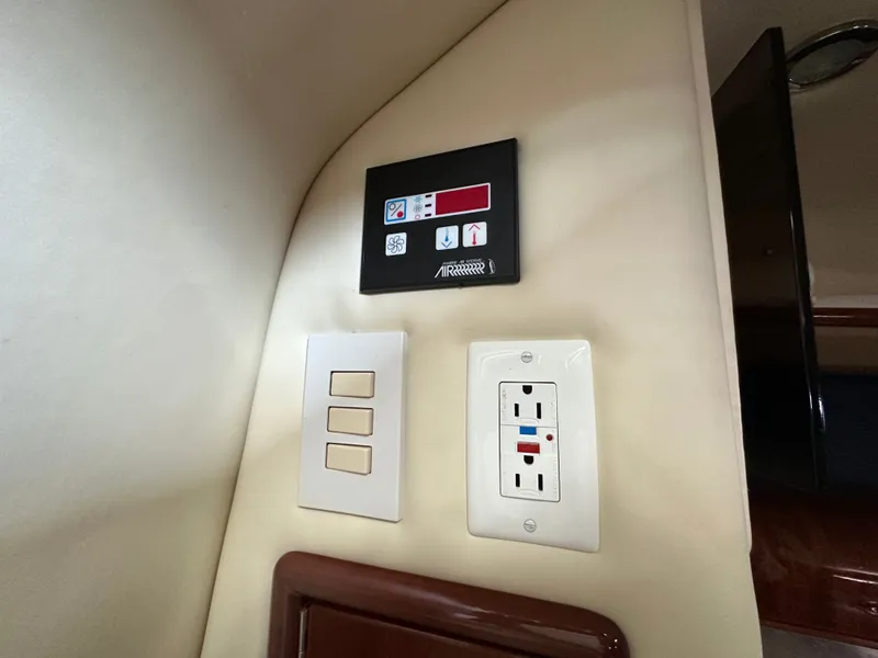 Slide: The Image of Control panel and outlet in a 2008 Cobalt 323 yacht. - 40