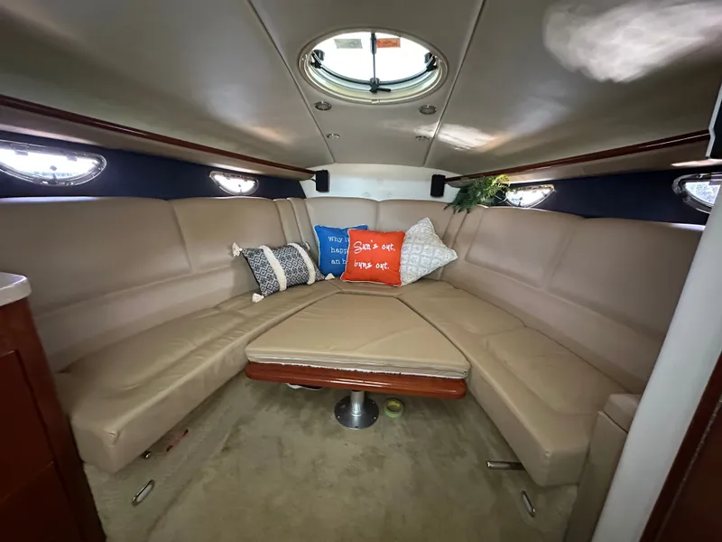 Slide: The Image of Interior of a 2008 Cobalt 323 boat with beige seating and cushions. - 41