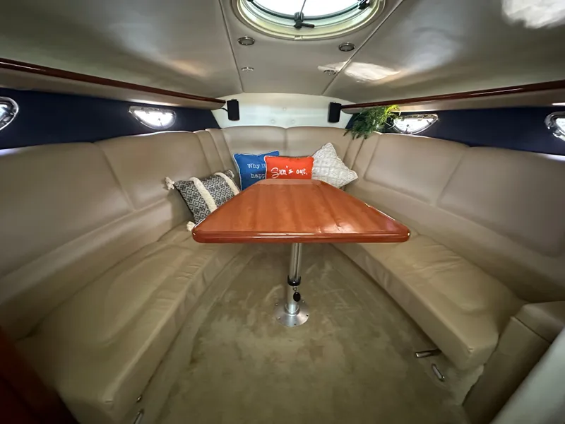 Slide: The Image of Interior of a 2008 Cobalt 323 boat with cozy seating area. - 42