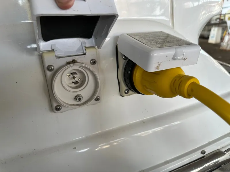 Slide: The Image of Close-up of a 2008 Cobalt 323 boat power connection. - 47