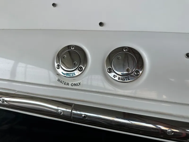 Slide: The Image of Water and waste ports on a 2008 Cobalt 323 boat. - 48