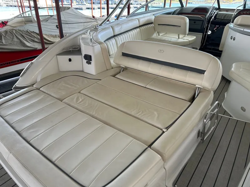 Slide: The Image of Interior of a 2008 Cobalt 323 boat with white leather seating. - 7