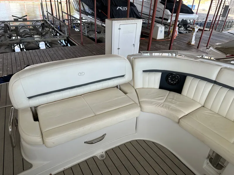 Slide: The Image of Interior of a 2008 Cobalt 323 boat with white leather seating. - 8