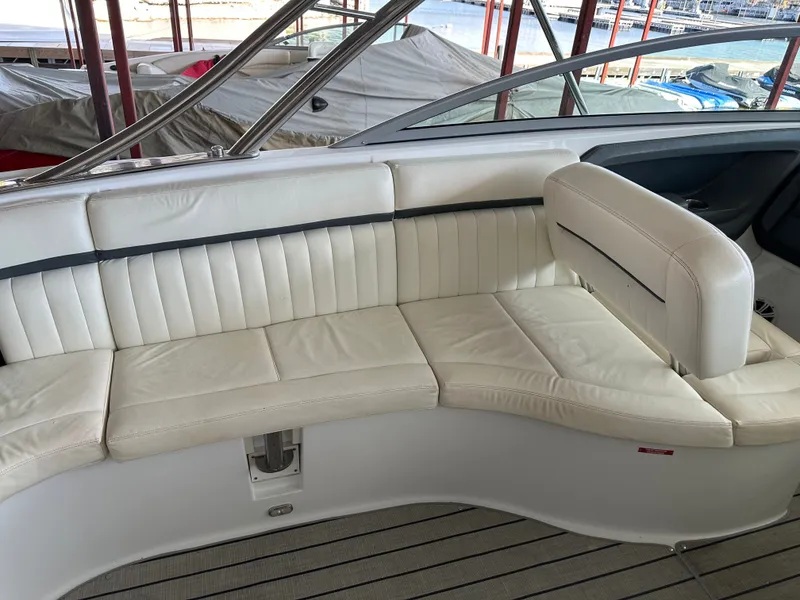 Slide: The Image of Interior of a 2008 Cobalt 323 boat with white leather seating. - 9