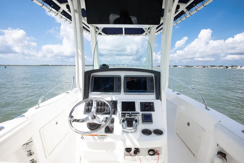Slide: The Image of Boston Whaler 250 Outrage 2010 boat console with steering wheel and Garmin Electronics Package - 31