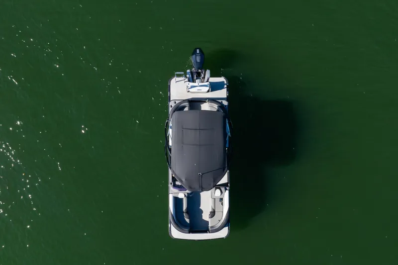 Slide: The Image of Aerial view of 2021 Avalon LSZ Quad Lounger boat on green water. - 12