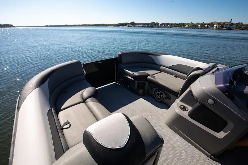 Slide: The Image of 2021 Avalon LSZ Quad Lounger boat interior with luxurious seating on a serene lake. - 3