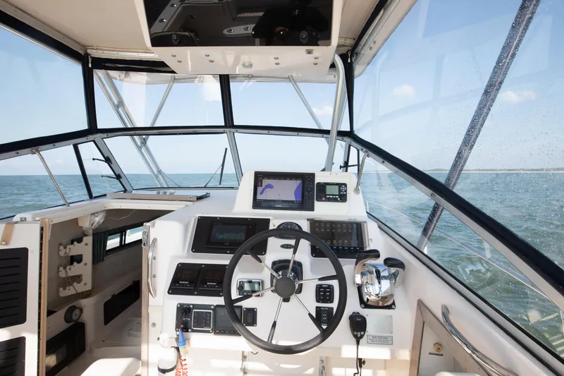 Slide: The Image of Cockpit view of 1997 Grady-White Marlin 300 boat on open water. - 52