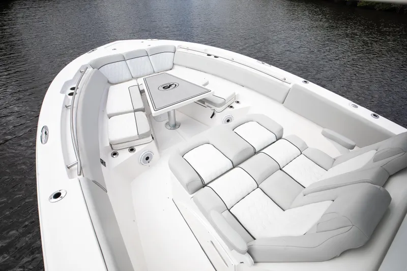 Slide: The Image of 2021 Sea Fox 368 Commander luxurious double lounge seating and actuated table that can be lowered to increase lounging area. - 12