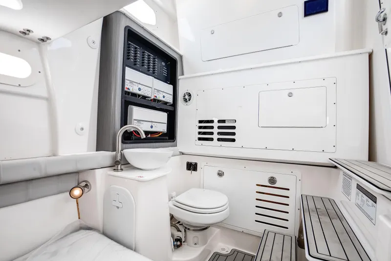 Slide: The Image of Interior of 2021 Sea Fox 368 Commander boat featuring a spacious head with modern amenities. - 13