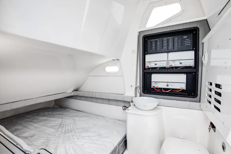 Slide: The Image of Interior cabin of 2021 Sea Fox 368 Commander with bed, sink, and control panel. - 14