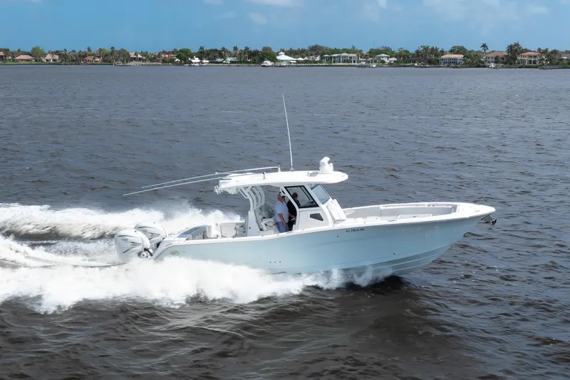 Slide: The Image of 2021 Sea Fox 368 Commander cruising on open water, showcasing sleek design and powerful engines. - 19