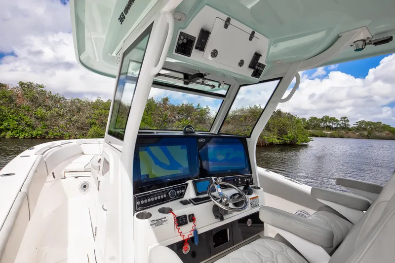 Slide: The Image of 2021 Sea Fox 368 Commander boat cockpit with dual screens and steering wheel. - 8