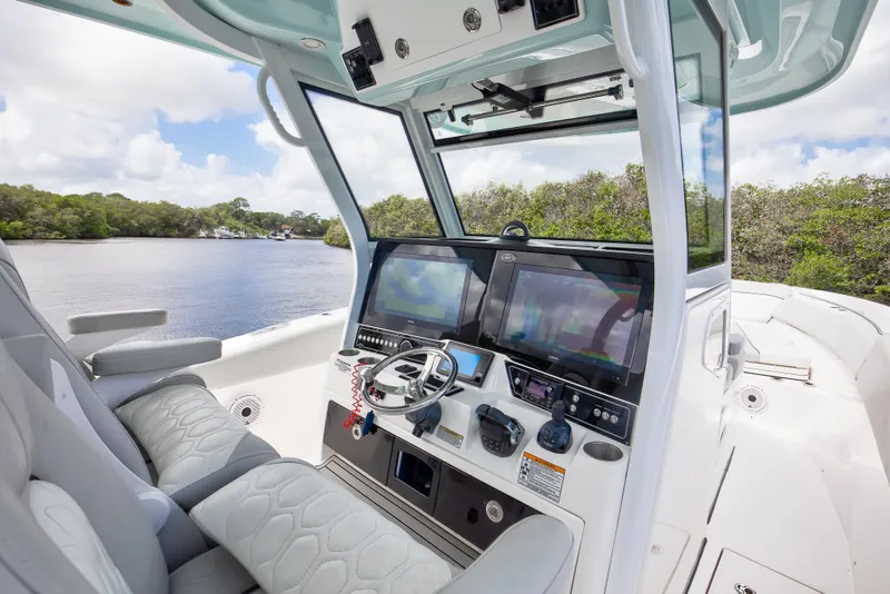 Slide: The Image of 2021 Sea Fox 368 Commander helm with advanced navigation displays and luxurious seating. - 9