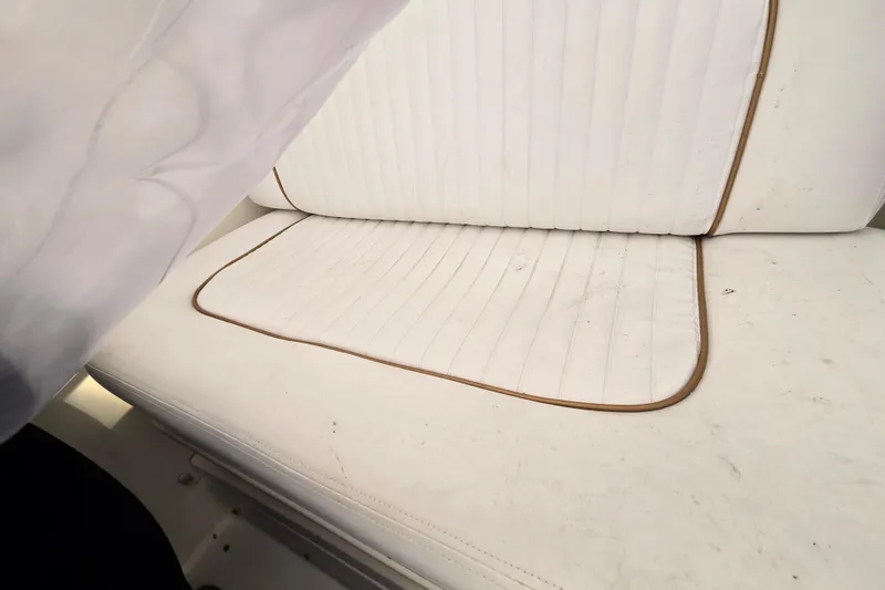 Slide: The Image of White cushioned seating on a 1998 Sea Ray 340 Amberjack boat. - 13