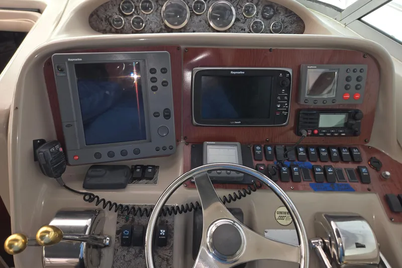 Slide: The Image of 1998 Sea Ray 340 Amberjack helm with navigation instruments and control panel. - 16