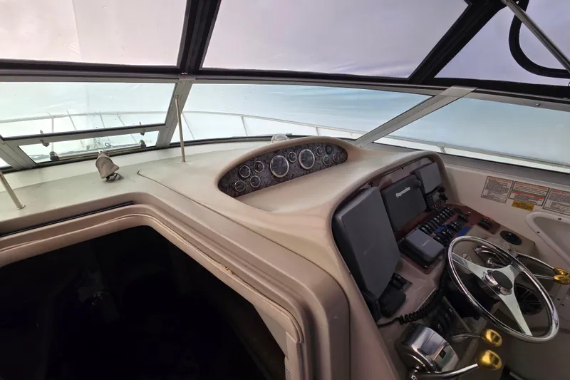 Slide: The Image of 1998 Sea Ray 340 Amberjack helm with steering wheel and instrument panel. - 18