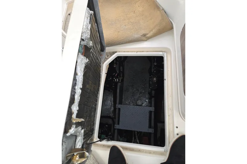 Slide: The Image of Engine compartment of a 1998 Sea Ray 340 Amberjack boat, showing interior details. - 29
